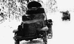 Бронеавтомобиль БА-10 патрулирует дорогу в районе Суоярви. Январь 1940 года. Машины ещё не перекрашены в белый цвет.