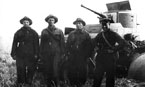 Экипаж М.С.Кочетова (в центре), на заднем плане бронеавтомобиль БА-6. 9-я мотоброневая бригада, июль 1939 года.