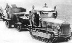 Японский тягач Тип 92 (5-тонный) буксирует в тыл захваченные в боях 6-7 июля бронеавтомобиль БА-6 и грузовик ЗиС-5 из состава 9-й мотоброневой бригады.