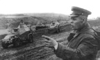 Командующий 3-й гвардейской танковой армией генерал-лейтенант П.С.Рыбалко наблюдает за прохождением колонны бронеавтомобилей БА-64 из состава разведбатальона армии. Воронежский фронт, октябрь 1943 года.