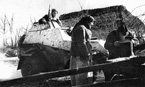 Экипаж бронеавтомобиля БА-64 во время рекогносцировки местности. 1-й Украинский фронт, февраль 1944 года.