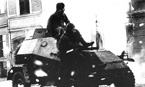БА-64Б с десантом в уличных боях. На броне тактический знак – ромб с номером (над чертой – 64, под чертой – 120). Померания, 1945 г.
