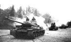 Колонна тяжелых танков ИС-2 из состава 27-го отдельного гвардейского танкового полка в центре Выборга. 1-й Прибалтийский фронт. Июнь 1944 года.