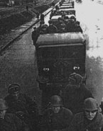 Колонна тракторов СТЗ-5 с пехотой движется к фронту. Пригород Москвы, 1941г