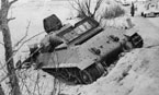 Т-34-57 командира танкового полка 21-й танковой бригады Героя Советского Союза майора Лукина, подбитый у деревни Трояново. Снимок сделан немцами 25 октября 1941 г, через несколько дней после боя.