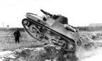Легкий танк 010 (образец № 6/2 с подвеской по типу тягача «Комсомолец») преодолевает препятствие. НИБТ полигон. Июль 1939 года.
