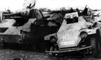 Сборный пункт аварийных машин после окончания боёв за Сталинград: слева танк Т-70, справа немецкий бронеавтомобиль Sd.Kfz 222. Весна 1943 года.