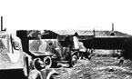 Бронеавтомобили из состава 2-ого отдельного автоброневого батальона 42 армии на учениях. Ленинградский фронт, лето 1942 года. На переднем плане импровизированный броневик Ижорского завода на шасси ЗиС-6, на заднем плане различим БА-11 - виден характерный скошенный лист бронировки верхней части задних колёс. Обращает на себя внимание трёхцветный камуфляж бронемашин.