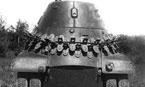 Вид сзади опытного образца бронеавтомобиля БА-11. НИБТПолигон. Лето 1939 года. Хорошо видна укладка вездеходных цепей "Оверолл" на корме корпуса.