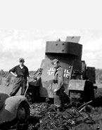 Тот же трофейный бронеавтомобиль БА-3 "Radetzky" в Вермахте. Броневик собирается вытаскивать застрявшую в грязи штабную машину. Белоруссия, лето 1941 года.