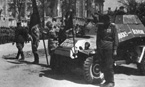 Парад у руин Рейхстага. 20 мая 1945 года. На переднем плане богато украшенный росписью броневичок БА-64Б: "Слава Сталину" на лобовом листе капота, "Кавказ-Берлин" - на борту.