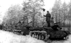 Колонна самоходных орудий под управлением лёгкого танка Т-70 перед маршем. 2-ой дивизион, 8-ой самоходно-артиллерийской бригады. Белорусский фронт, февраль 1944 года.